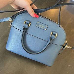 Blue Kate Spade hand bag with shoulder strap. Lightly used.